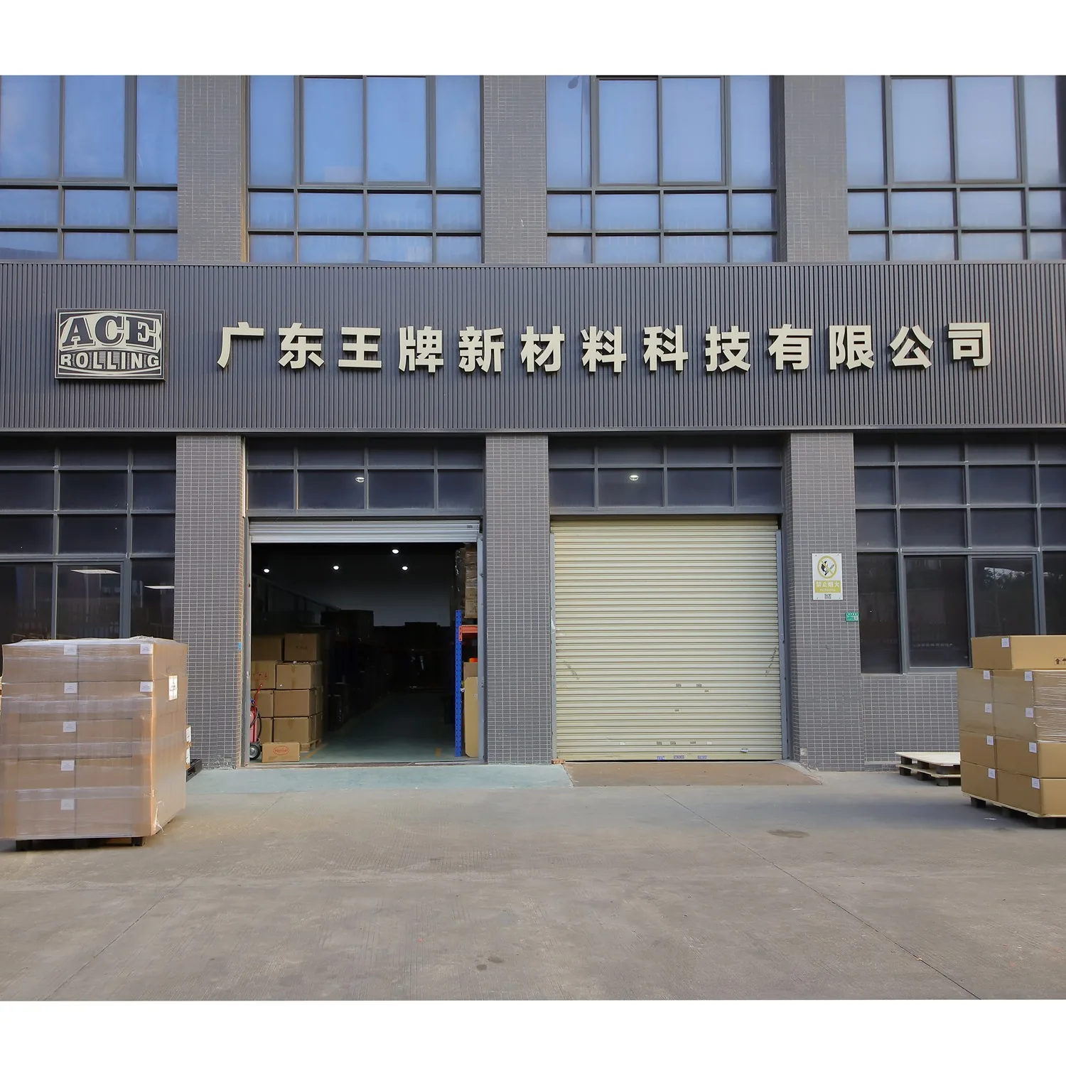 Ace Rolling factory entrance with company sign and cartons