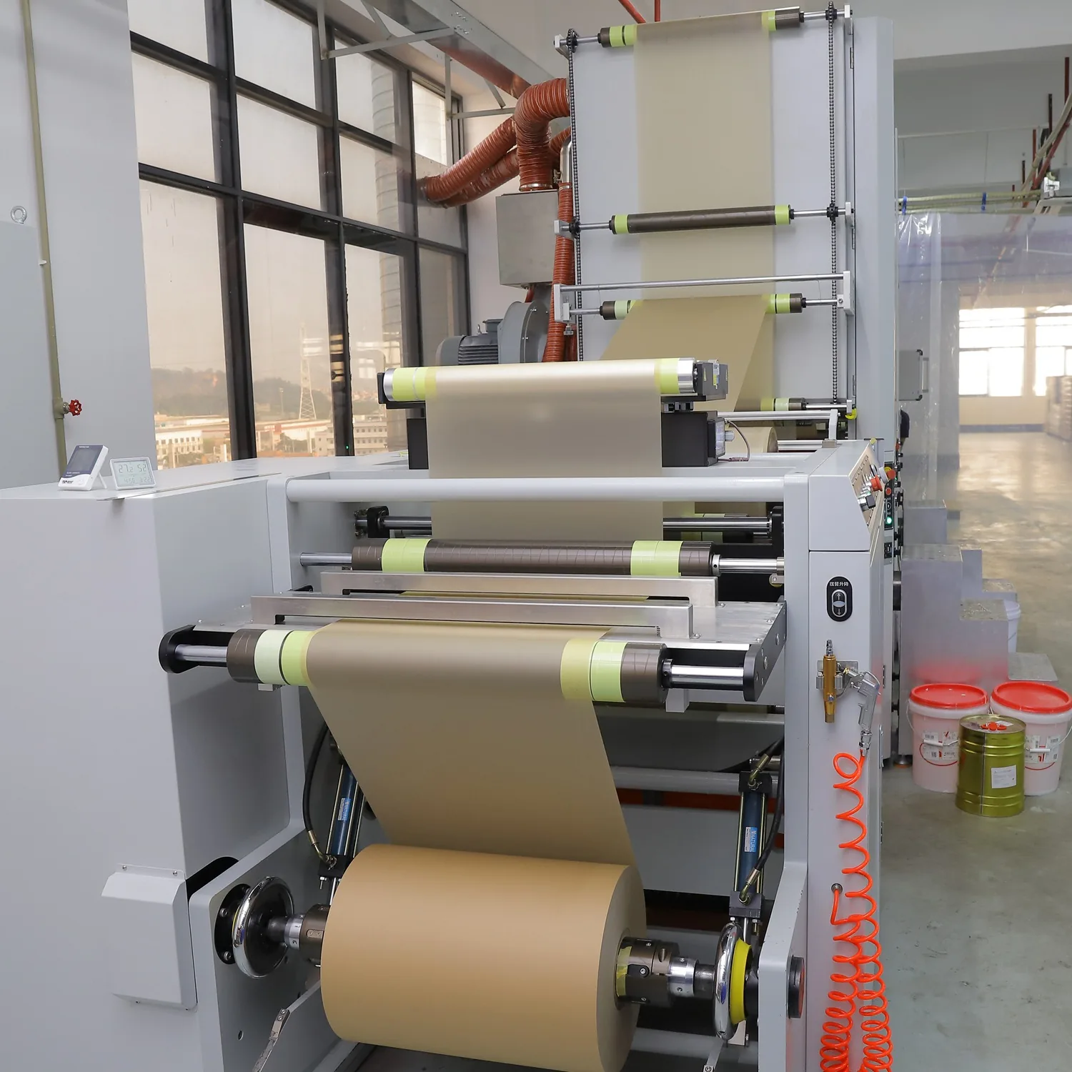 Large paper roll machine with web feeding system