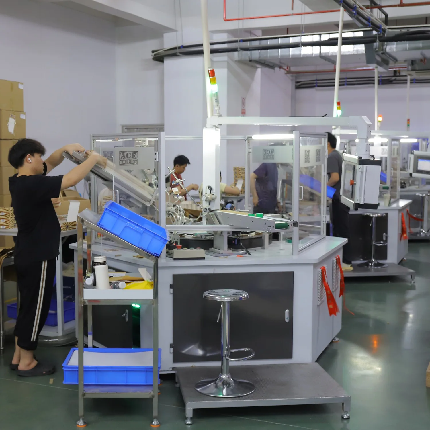 Production technician sorting and packing sealed container units