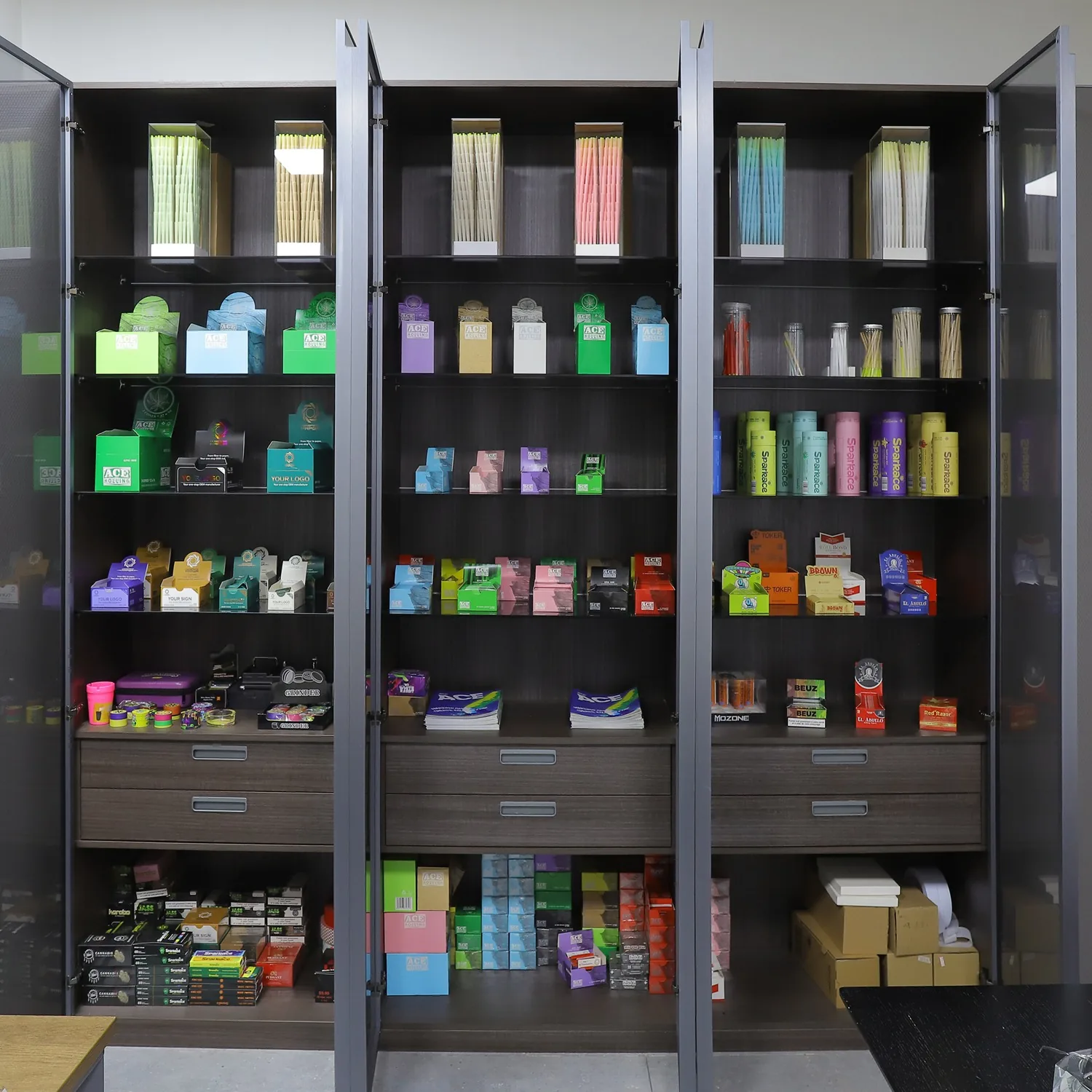 Sample cabinet with rolling paper and cone packages