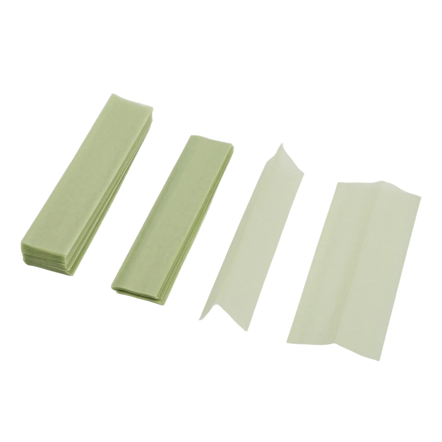 Natural thin rolling paper sheets and stacks on white background