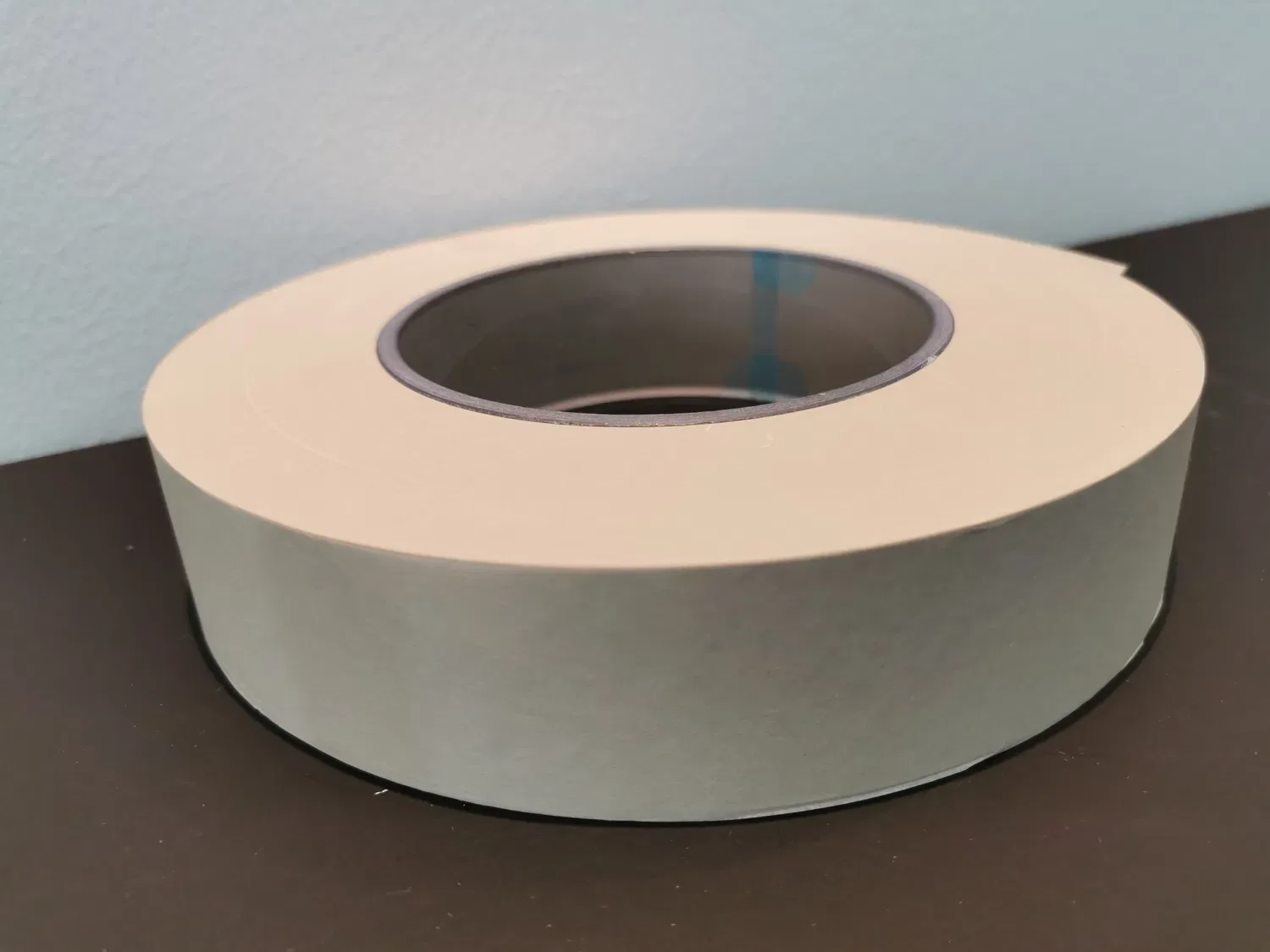 Close-up industrial bobbin of thin rolling paper stock