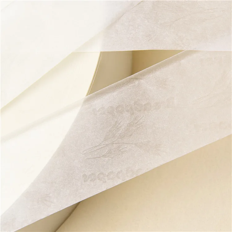Thin watermarked rolling paper sheets in close-up