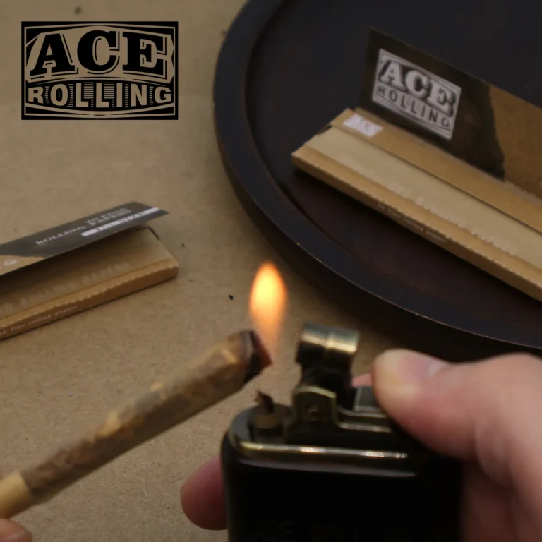 Ace Rolling 1 1/4 size papers with a finished roll being lit