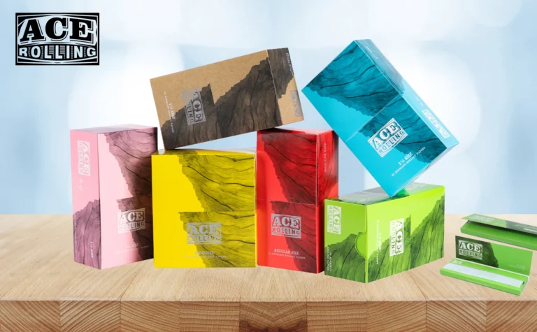 Ace Rolling multi-color display boxes and open rolling paper booklets on a table