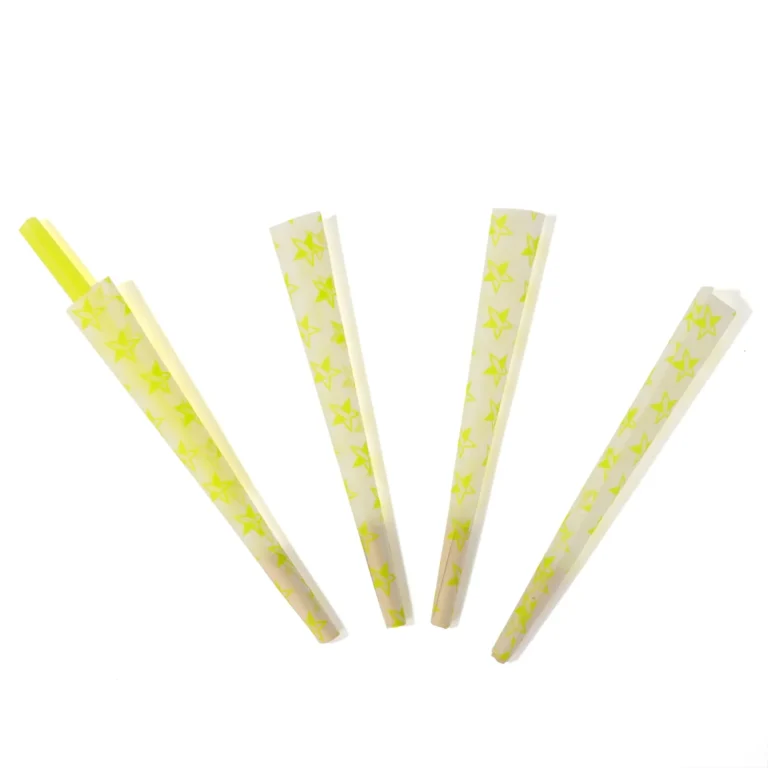 Loose yellow printed pre-rolled cones showing paper color and construction