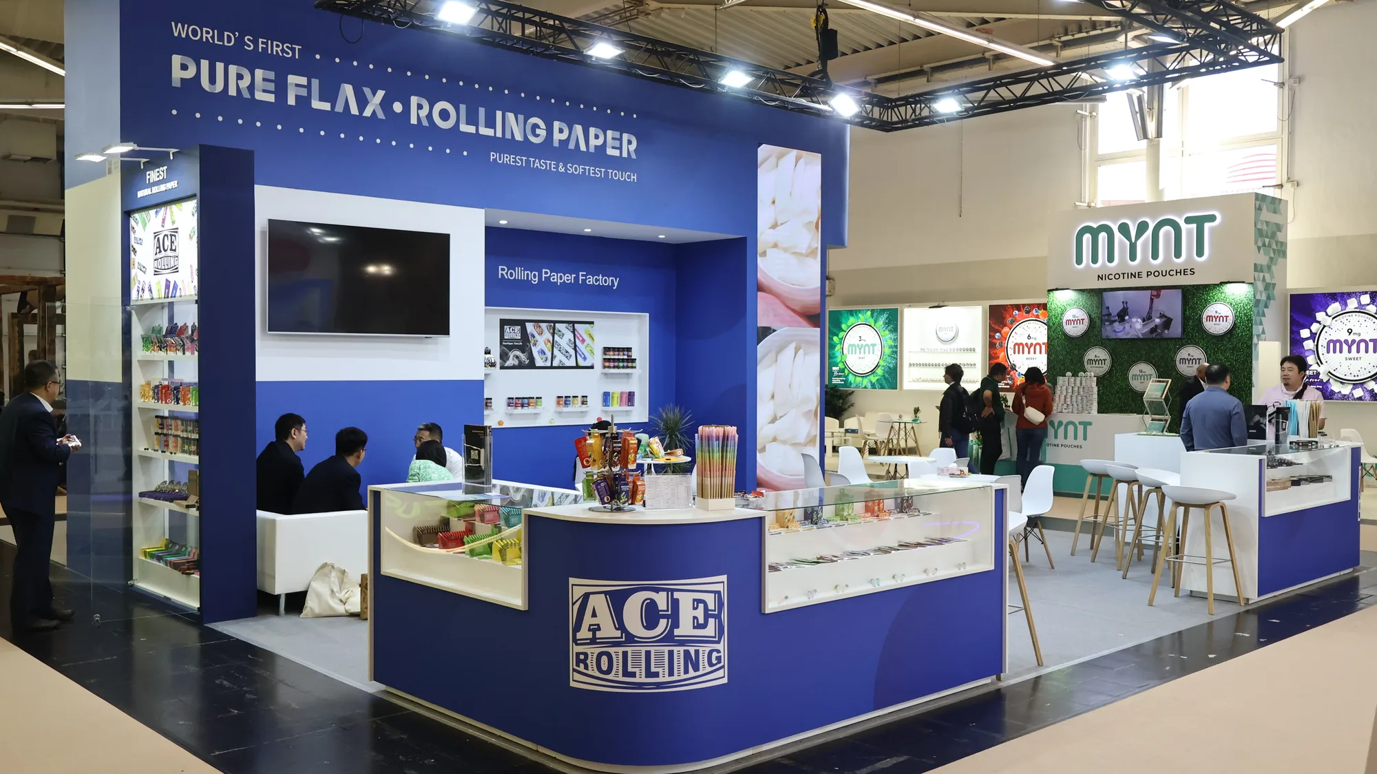 Trade expo booth showing B2B factory-facing rolling paper manufacturing context