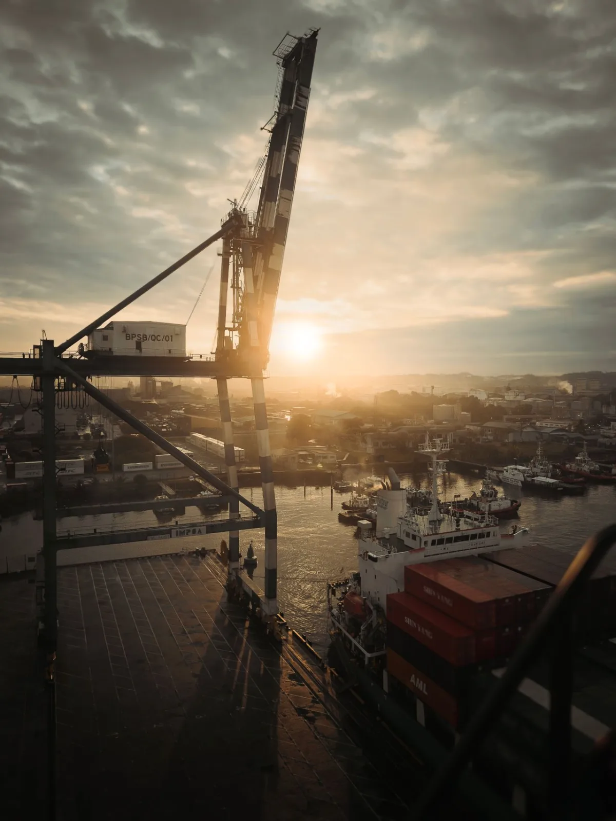 Cargo port shipping containers at sunset for commercial import and wholesale logistics