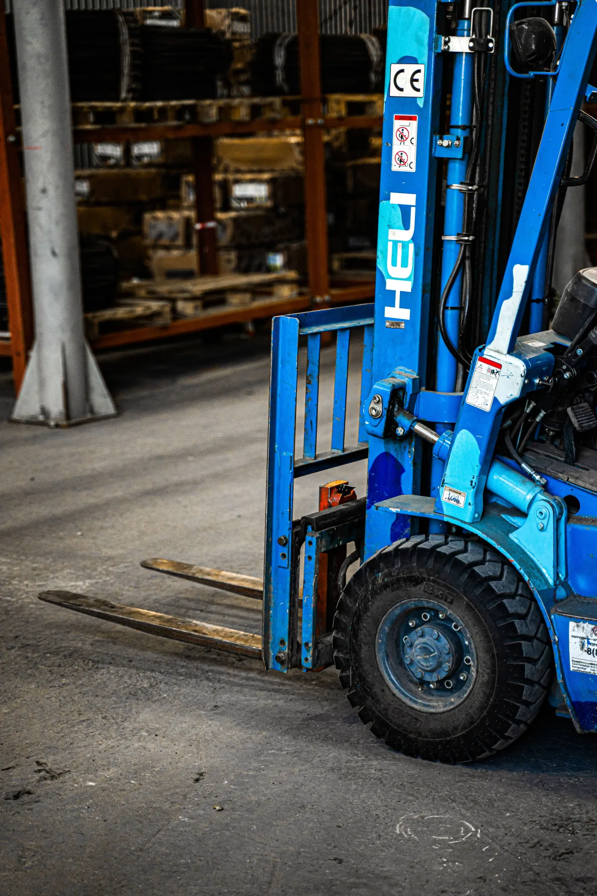Forklift moving palletized goods in a warehouse