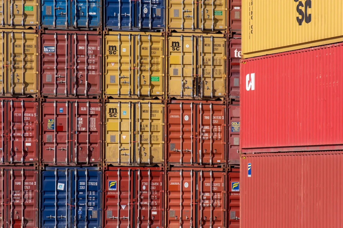 Stacked shipping containers at port for export freight