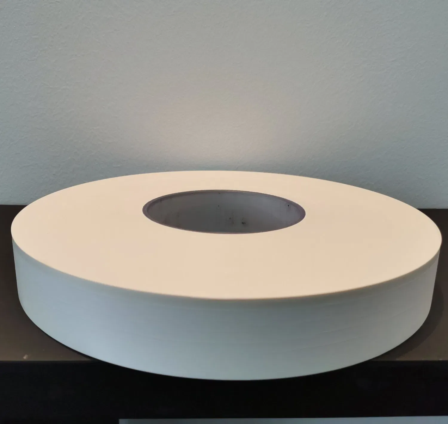 Paper bobbins cut on an angle before anyone rolls a cone