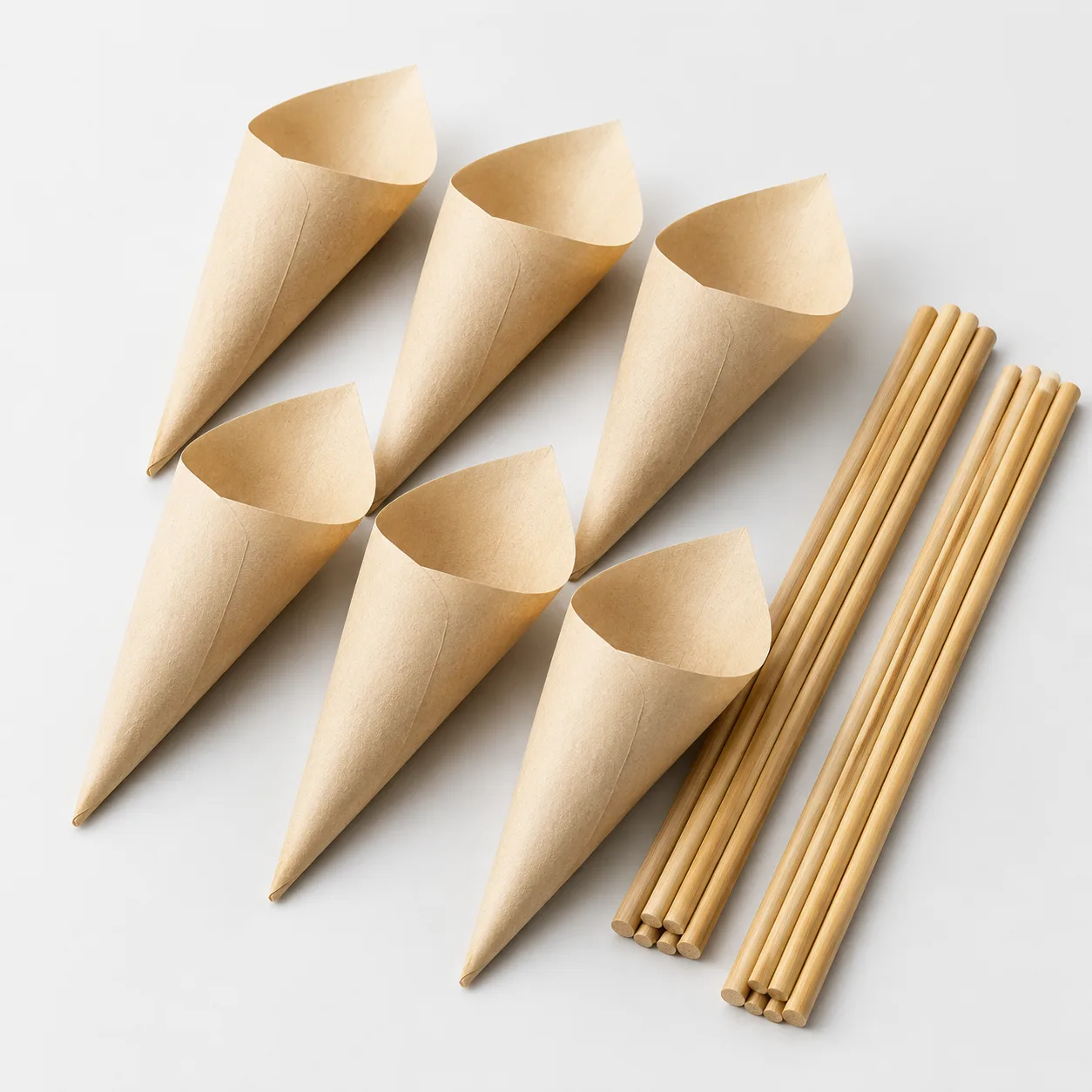 Empty unbleached pre-roll cones paired with natural bamboo packing sticks
