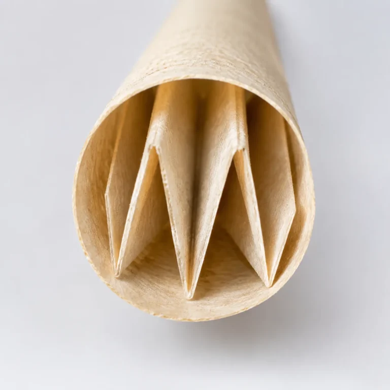 Macro view directly into the W-fold accordion paper filter tip mouthpiece